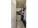 Walk-in closet with shelves, drawers, and hanging space provides ample storage, keeping your wardrobe organized and accessible at 2442 Foxhollow Rd, Tavares, FL 32778