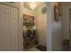 Charming entryway featuring a decorative console table, elegant lighting, and a welcoming 'Aloha' mat at 2442 Foxhollow Rd, Tavares, FL 32778