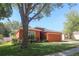 Charming single-story home with a well-manicured lawn and attached two car garage at 2442 Foxhollow Rd, Tavares, FL 32778