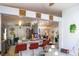 Open-concept living space connecting the kitchen and living area, creating a welcoming atmosphere at 2442 Foxhollow Rd, Tavares, FL 32778