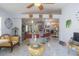 Open-concept living space featuring a kitchen with bar-style seating and a clear view of the living room at 2442 Foxhollow Rd, Tavares, FL 32778