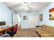 Home office with a ceiling fan, a closet, and a futon at 2488 Ansley Path, The Villages, FL 32162
