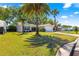 Well-maintained single-story home featuring a two-car garage and lush green lawn at 2488 Ansley Path, The Villages, FL 32162