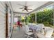 Enclosed screened lanai featuring a ceiling fan and access to backyard landscaping at 2488 Ansley Path, The Villages, FL 32162
