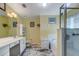 Well-lit bathroom featuring marble tile floor, shower, and bath at 27121 Greenfly Orchid Ln, Leesburg, FL 34748