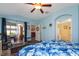 Bedroom with slider doors and en suite bathroom at 27121 Greenfly Orchid Ln, Leesburg, FL 34748