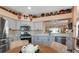 Modern kitchen equipped with stainless steel appliances and granite countertops at 27121 Greenfly Orchid Ln, Leesburg, FL 34748