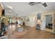 Bright living room with wood flooring, access to the lanai, and nautical decor at 28416 Tammi Dr, Tavares, FL 32778