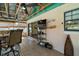 Enclosed sunroom offering seating, a flat-screen TV, and an open view to the backyard at 28416 Tammi Dr, Tavares, FL 32778