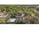 Aerial view showcasing a one-story house among mature trees and additional buildings and RV at 331 W Lewis Ave, Apopka, FL 32712
