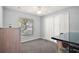 Bedroom with light blue walls, gray carpet, bright windows and closet at 331 W Lewis Ave, Apopka, FL 32712