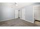 Spacious bedroom with gray carpet, light blue walls, ceiling fan and white trim at 331 W Lewis Ave, Apopka, FL 32712