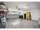 Spacious garage featuring a roll-up door, ample storage space, and a clean, organized interior at 331 W Lewis Ave, Apopka, FL 32712