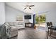Comfortable living room with a ceiling fan and sliding glass doors to the patio at 331 W Lewis Ave, Apopka, FL 32712