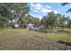 Beautiful property with mature trees, lush greenery, well-maintained lawn, and a serene atmosphere at 331 W Lewis Ave, Apopka, FL 32712