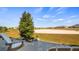 Paver patio with outdoor seating and manicured landscaping overlooking a serene green space at 3512 Belland Cir # B, Clermont, FL 34711