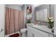 Bathroom with a shower with curtain, a toilet and a vanity at 3512 Belland Cir # B, Clermont, FL 34711