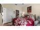 Bedroom featuring a bathroom, a double door closet and an elegant floral comforter at 3512 Belland Cir # B, Clermont, FL 34711