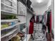 Well-organized walk-in closet featuring shelving, storage containers, and multiple hanging options at 3512 Belland Cir # B, Clermont, FL 34711