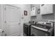 A well equipped laundry room featuring a washing machine and a dryer at 3512 Belland Cir # B, Clermont, FL 34711