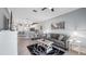 Bright living space featuring a comfortable sofa, open floor plan, and modern decor at 3512 Belland Cir # B, Clermont, FL 34711