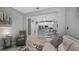 The living room opens to the kitchen and features a comfortable seating arrangement and neutral walls at 3512 Belland Cir # B, Clermont, FL 34711