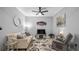 The living room features neutral walls, a ceiling fan, and an entertainment center below the TV at 3512 Belland Cir # B, Clermont, FL 34711