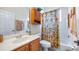 Bathroom with a vanity, mirror, and a shower with a decorative shower curtain at 3728 Mulberry Grove Loop, Leesburg, FL 34748