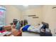Bedroom with a bed, desk, closet, and a window providing natural light at 3728 Mulberry Grove Loop, Leesburg, FL 34748