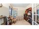 Home office with a desk, comfortable seating, and built-in storage for optimal productivity at 3728 Mulberry Grove Loop, Leesburg, FL 34748