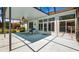 Relaxing screened-in patio with pool, ceiling fan and furniture at 3728 Mulberry Grove Loop, Leesburg, FL 34748