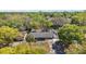 An aerial view of the single Gathering home nestled amongst lush greenery and mature trees at 3860 Branch Ave, Mount Dora, FL 32757