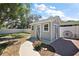 Backyard with a storage shed, an outdoor wagon wheel, and landscaping at 3860 Branch Ave, Mount Dora, FL 32757