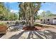 Spacious backyard with patio, shed, and mature trees at 3860 Branch Ave, Mount Dora, FL 32757