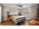 Bright bedroom features wood floors, ceiling fan, and charming decor at 3860 Branch Ave, Mount Dora, FL 32757
