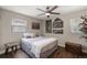 Bedroom with wood floors, natural light, and stylish decor at 3860 Branch Ave, Mount Dora, FL 32757