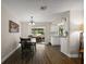 Bright dining room area featuring modern flooring and natural light from sliding glass doors at 3860 Branch Ave, Mount Dora, FL 32757