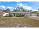Charming single story home featuring a manicured lawn and an attached two car garage at 3860 Branch Ave, Mount Dora, FL 32757