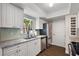 Recently renovated kitchen featuring stainless steel appliances, granite countertops, and updated lighting at 3860 Branch Ave, Mount Dora, FL 32757