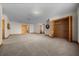 Large bonus room with neutral paint, carpet flooring, two closets, and three entry ways at 39636 Carolina Ave, Lady Lake, FL 32159