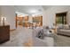 Bright dining area with backyard views, chandelier, and transition to kitchen with stainless appliances at 39636 Carolina Ave, Lady Lake, FL 32159