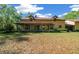 Charming two-story home featuring a full front porch, dormer windows, and mature landscaping at 39636 Carolina Ave, Lady Lake, FL 32159