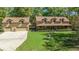 Charming home with a large front yard, three dormer windows, and an attached three-car garage at 39636 Carolina Ave, Lady Lake, FL 32159