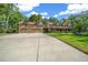 Lovely home featuring an oversized three-car garage, green lawn, and a covered porch with dormer windows at 39636 Carolina Ave, Lady Lake, FL 32159