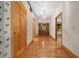 Inviting foyer with hardwood floors, decorative wallpaper, and a beautiful wooden front door at 39636 Carolina Ave, Lady Lake, FL 32159