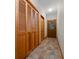 Hallway featuring wood doors, closet, and ceramic tile floors at 39636 Carolina Ave, Lady Lake, FL 32159