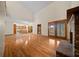 Open concept living room with hardwood floors, fireplace, and an eat in kitchen at 39636 Carolina Ave, Lady Lake, FL 32159
