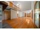 Spacious living room features wood floors, a fireplace, and an open floor plan at 39636 Carolina Ave, Lady Lake, FL 32159