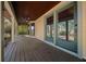 Inviting outdoor porch area with ceiling fan, swing, and picturesque views at 39636 Carolina Ave, Lady Lake, FL 32159