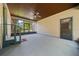 Screened-in porch showcasing ceiling fan, door, and staircase with views of yard at 39636 Carolina Ave, Lady Lake, FL 32159